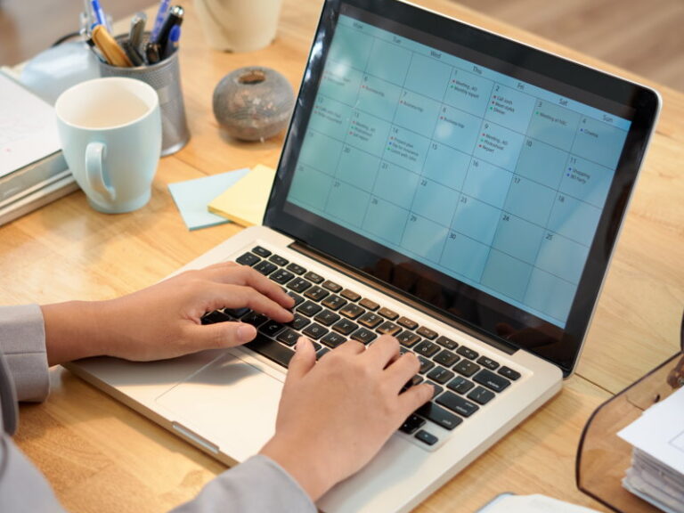 business woman making schedule for the month